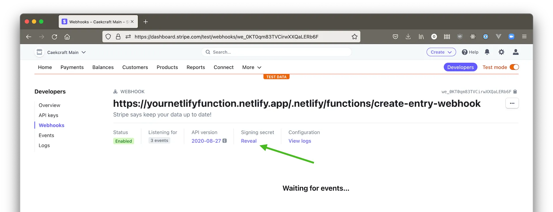 Screenshot of the Stripe webhook details with an arrow pointing to the Reveal link