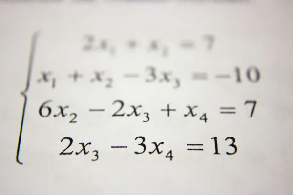 Multivariant math equations printed on paper.