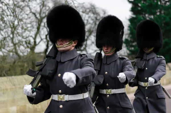 Picture of three guards on patrol at Windsor Castle, United Kingdom.